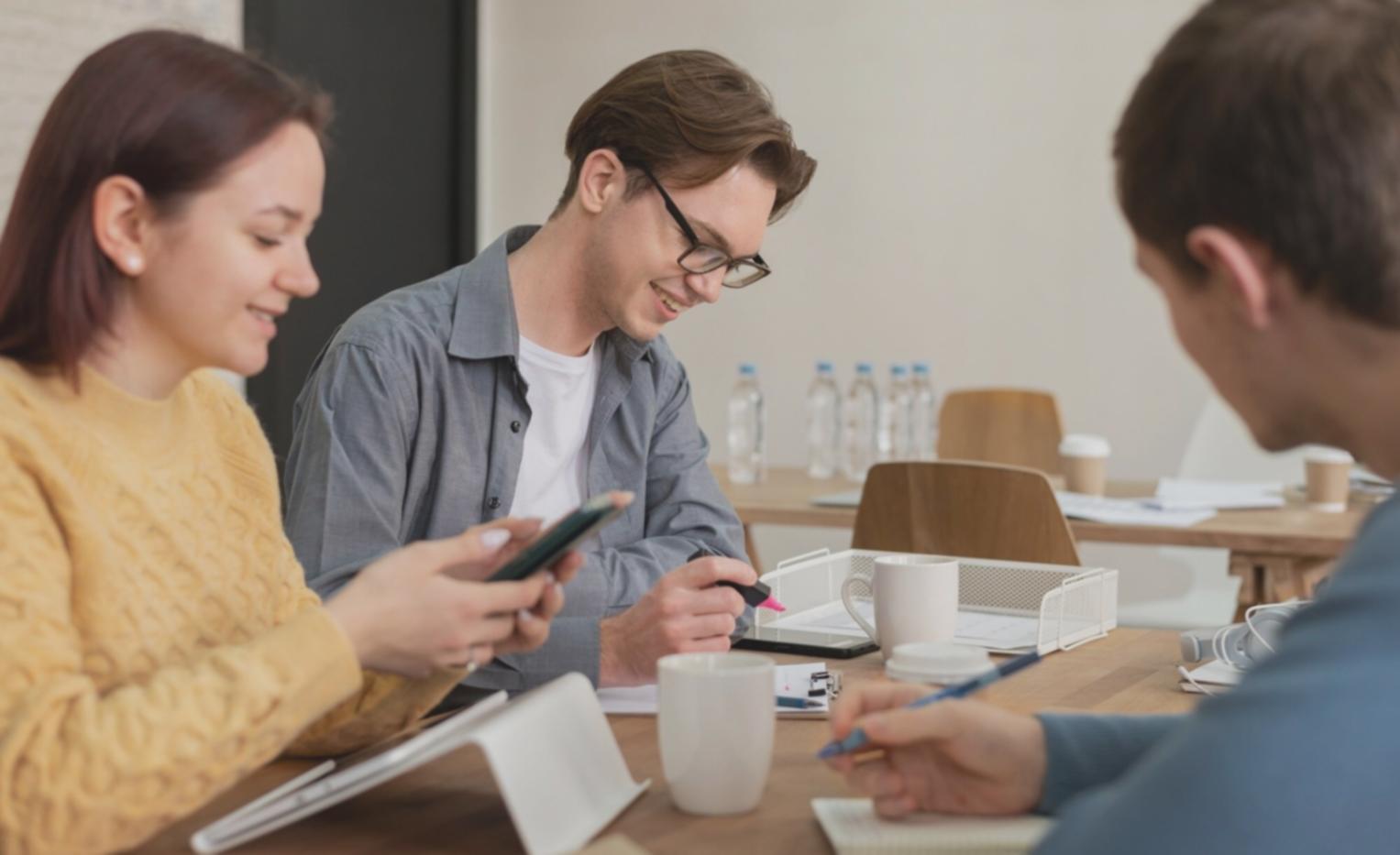 Business professionals analysing financial forecasting data on multiple screens